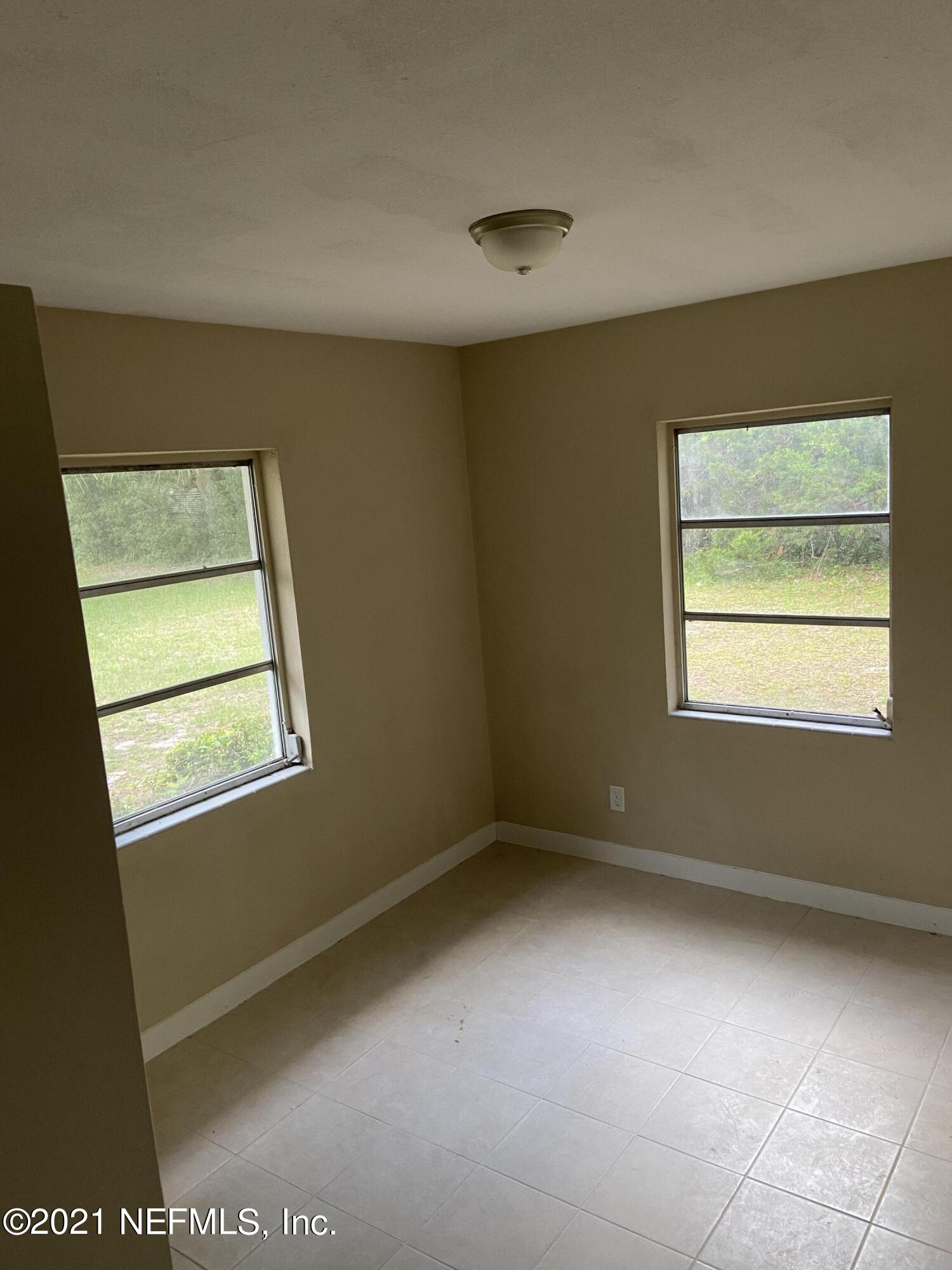 5643 Merrill Road, Unit 4 Jacksonville, FL 32277 - Photo 2 of 9 a view of an empty room with a window