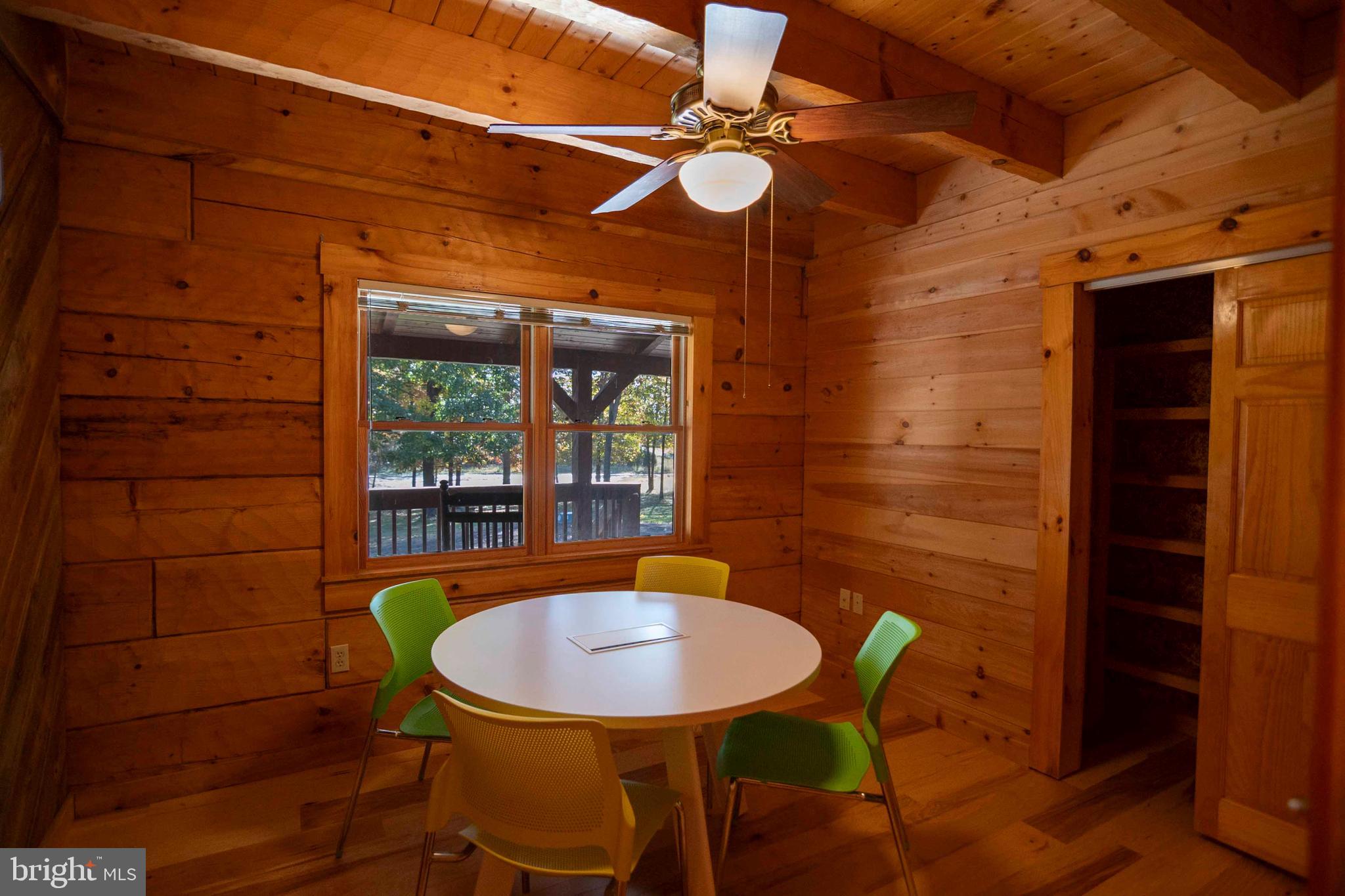 10201 Leetown Road Kearneysville, WV 25430 - Photo 63 of 133 a view of a dining room with a table and chairs