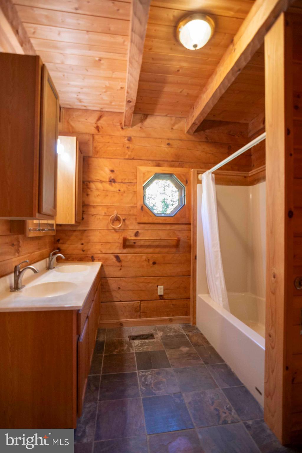 10201 Leetown Road Kearneysville, WV 25430 - Photo 71 of 133 a bathroom with a sink and a mirror