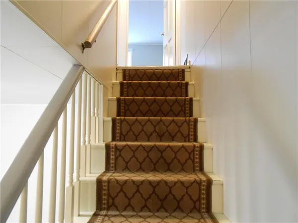 a view of an empty room with a closet