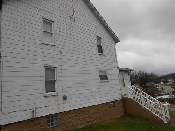 a view of a house with a roof deck