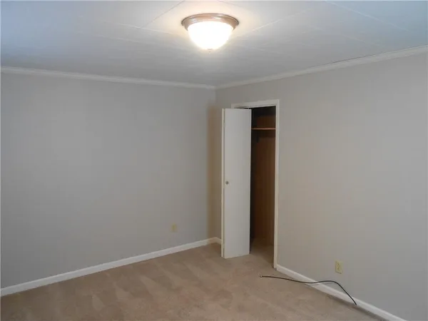 a kitchen with white cabinets and a sink