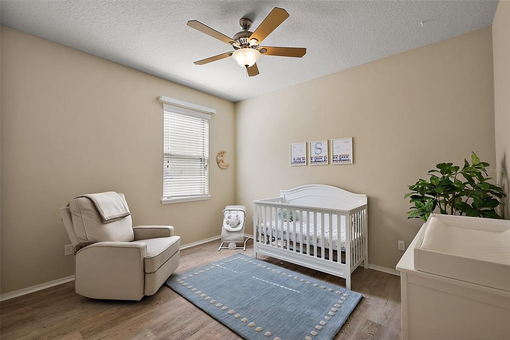 20945 Oldenburg Loop Mount Dora, FL 32757 - Photo 20 of 37 a living room with furniture and a window