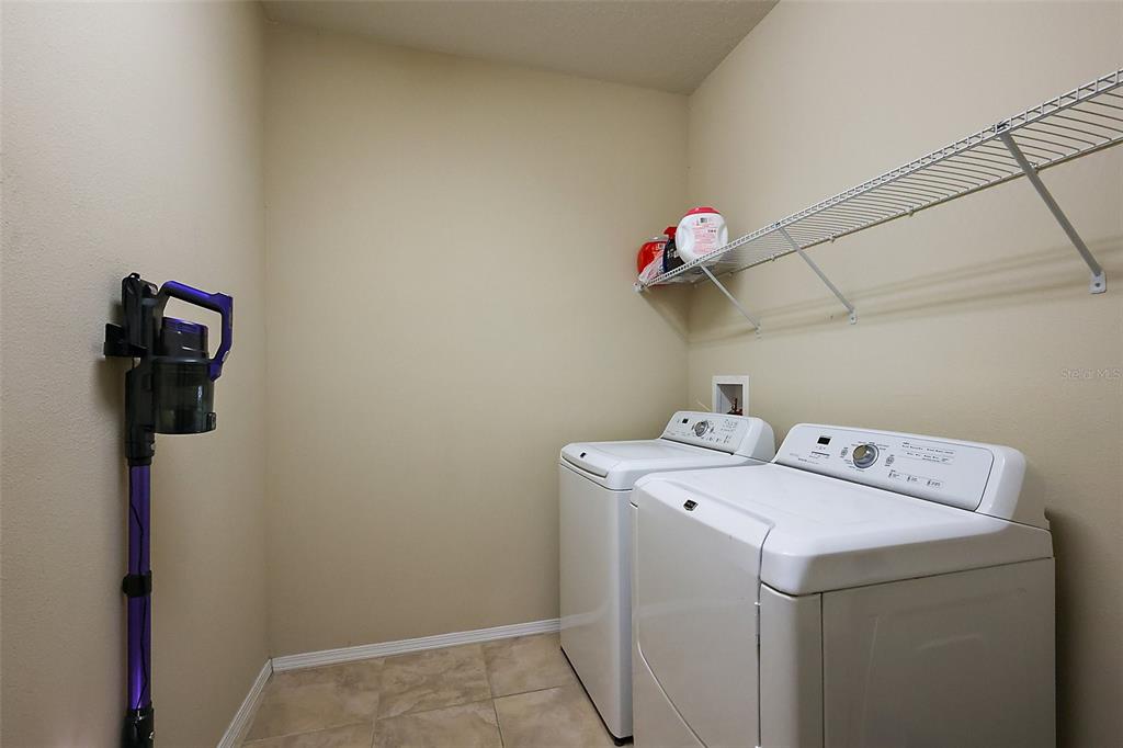 20945 Oldenburg Loop Mount Dora, FL 32757 - Photo 24 of 37 a utility room with dryer and washer