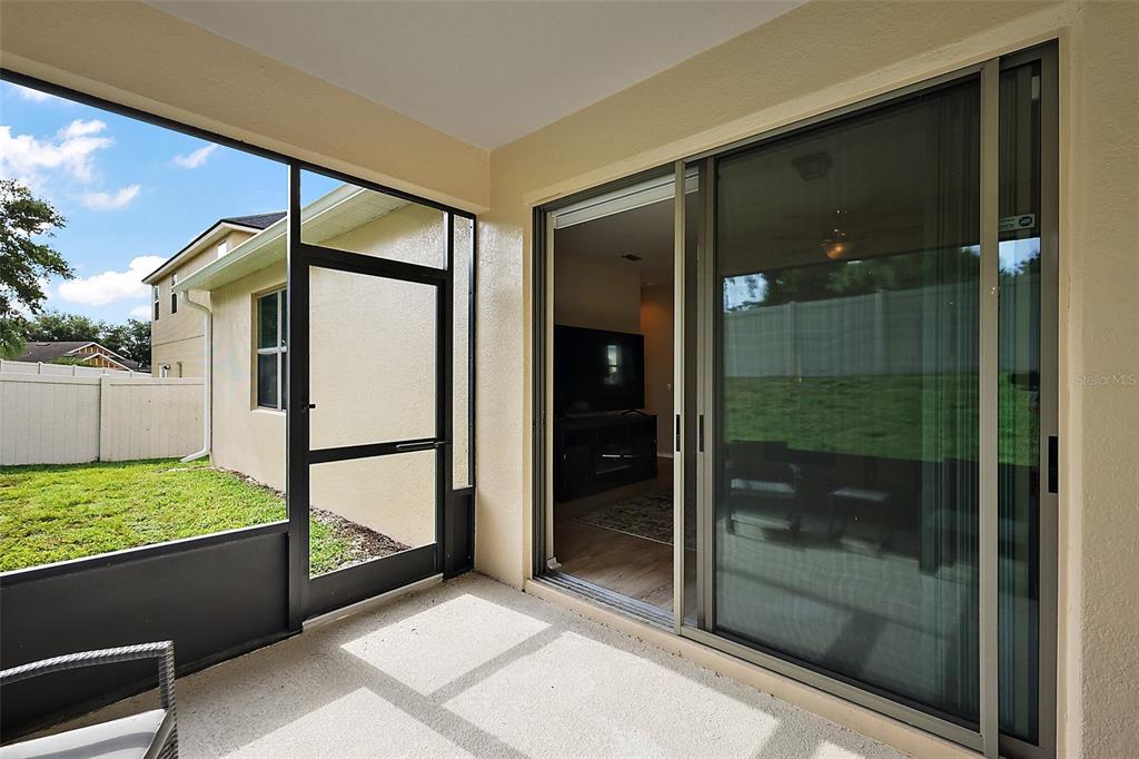 20945 Oldenburg Loop Mount Dora, FL 32757 - Photo 25 of 37 a bathroom with a glass shower door and a sink