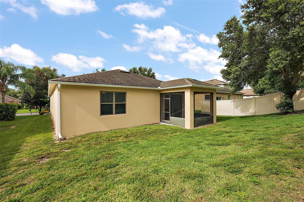 20945 Oldenburg Loop Mount Dora, FL 32757 - Photo 27 of 37 a view of a house with a yard