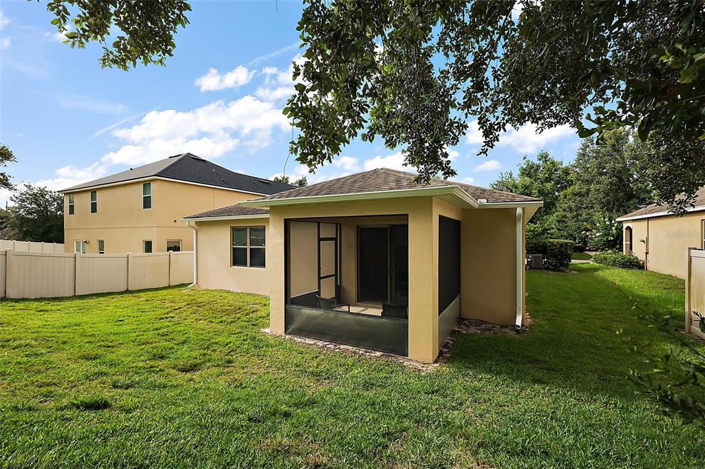 20945 Oldenburg Loop Mount Dora, FL 32757 - Photo 28 of 37 a front view of a house with a yard