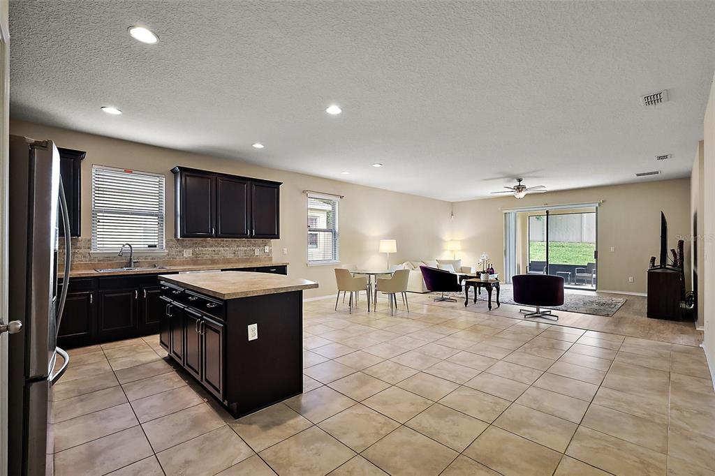 20945 Oldenburg Loop Mount Dora, FL 32757 - Photo 3 of 37 a kitchen with lots of counter top space and appliances