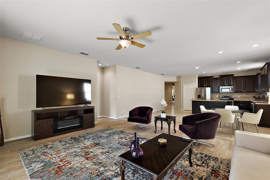20945 Oldenburg Loop Mount Dora, FL 32757 - Photo 7 of 37 a living room with furniture and a flat screen tv