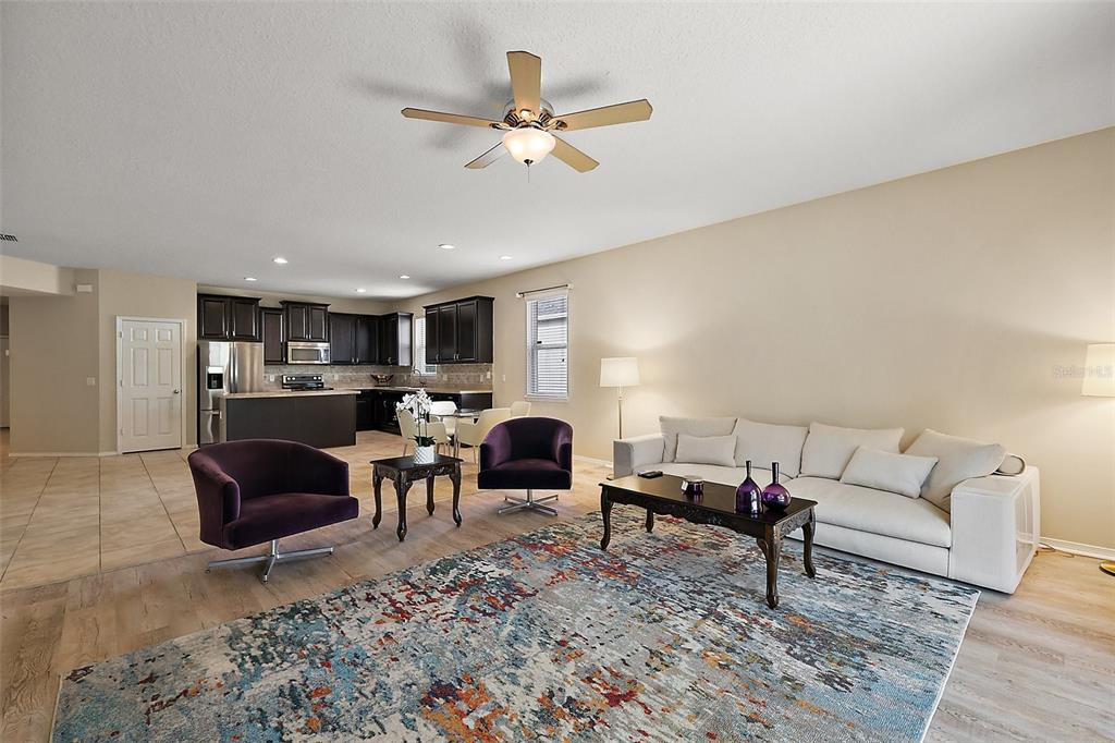 20945 Oldenburg Loop Mount Dora, FL 32757 - Photo 9 of 37 a living room with furniture and a rug