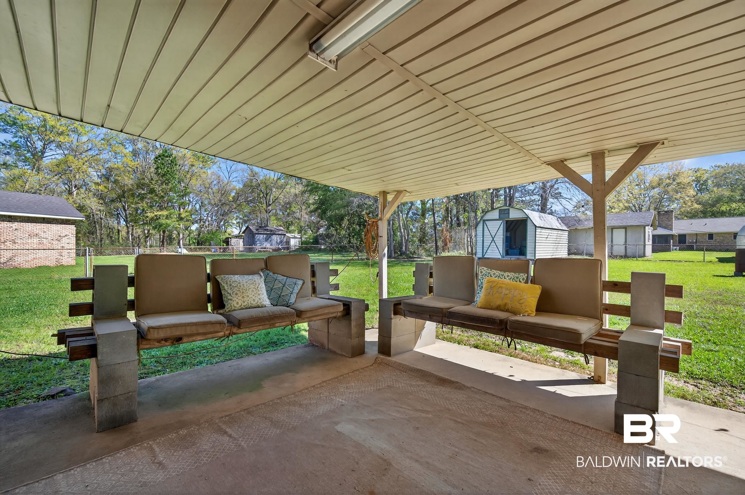 46006 Pecan Lane Bay Minette, AL 36507 - Photo 31 of 40 Fenced backyard featuring a patio area, a shed, and an outdoor living space