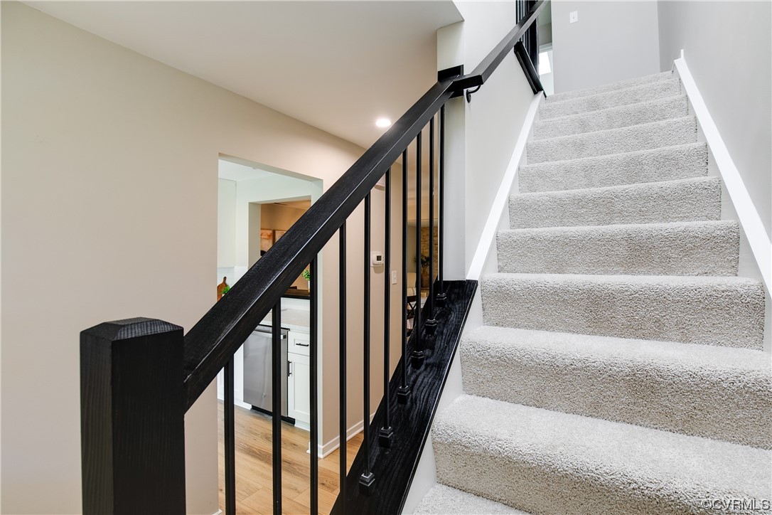 2102 Waters Mill Pointe Richmond, VA 23235 - Photo 22 of 43 a view of staircase with wooden floor and white walls
