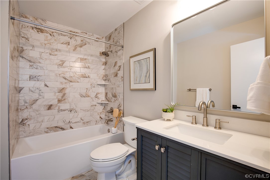 2102 Waters Mill Pointe Richmond, VA 23235 - Photo 28 of 43 a bathroom with a sink a toilet and a bathtub