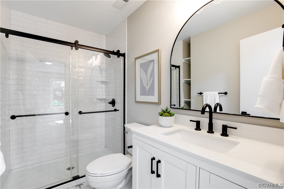 2102 Waters Mill Pointe Richmond, VA 23235 - Photo 33 of 43 a bathroom with a sink toilet a mirror and shower