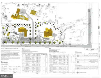 a front view of house with yard and trees in the background