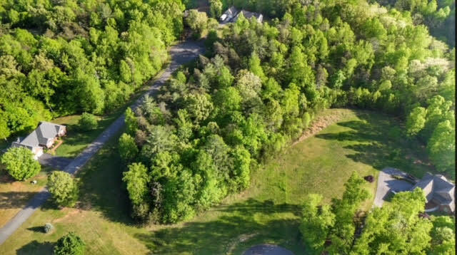 Lot 30 Revolution Road Wirtz, VA 24184 - Photo 7 of 8 a backyard of a house with lots of green space