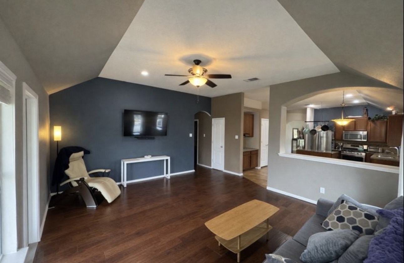 1052 Hot Spring Valley Buda, TX 78610 - Photo 11 of 36 Living room with vaulted ceiling, arched walkways, dark wood-style floors, ceiling fan, and recessed lighting
