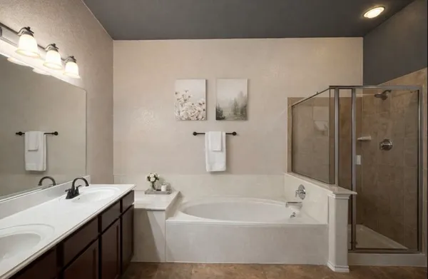 a bathroom with a sink vanity and a mirror