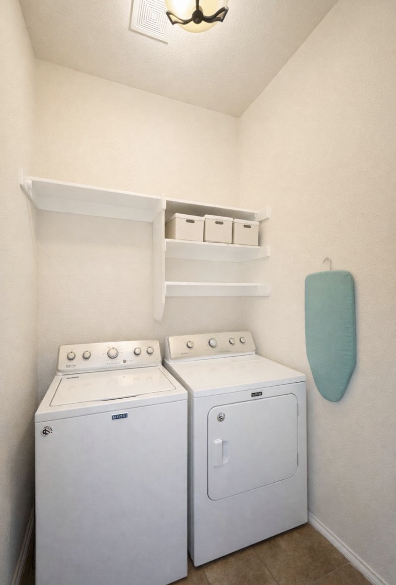 1052 Hot Spring Valley Buda, TX 78610 - Photo 28 of 36 Laundry area with washing machine and dryer and dark tile patterned floors