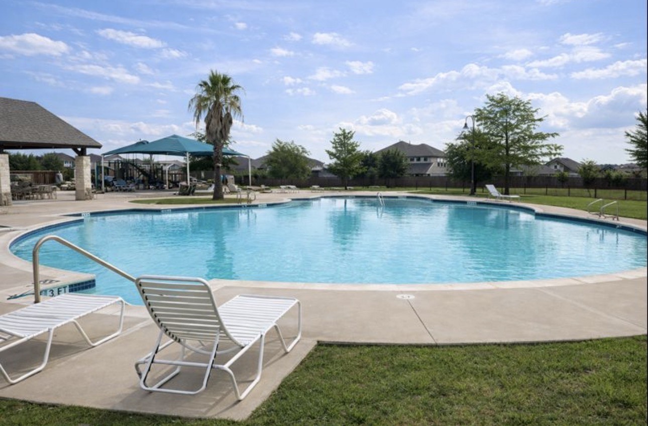 1052 Hot Spring Valley Buda, TX 78610 - Photo 34 of 36 Community pool with a patio