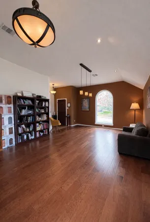 a view of a livingroom with furniture and a wooden floor