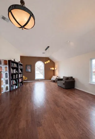 a view of a livingroom with furniture and wooden floor