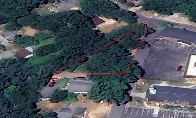 an aerial view of house with a yard