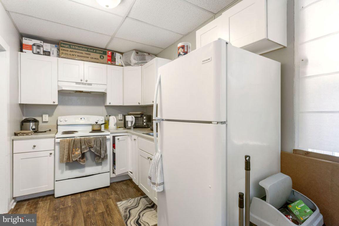 128 High Street Hanover, PA 17331 - Photo 16 of 36 a kitchen with stainless steel appliances a refrigerator sink and white cabinets
