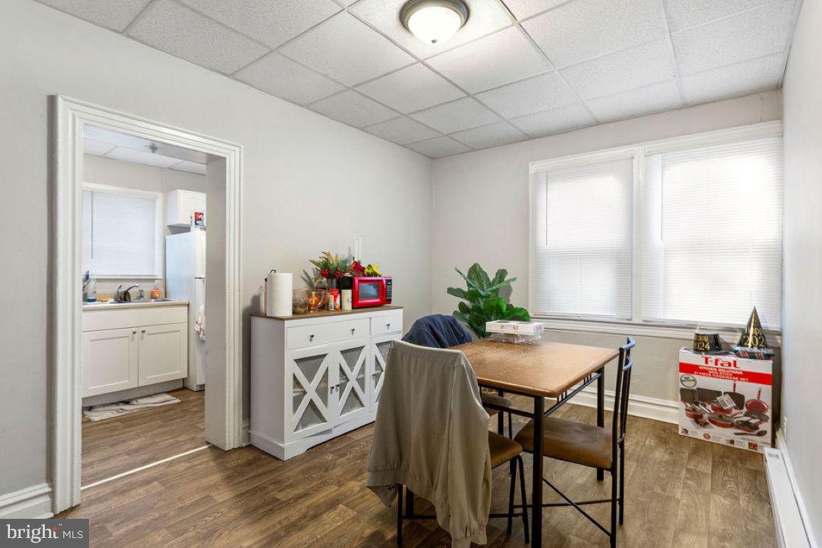 128 High Street Hanover, PA 17331 - Photo 17 of 36 a view of a dining room with furniture window and wooden floor