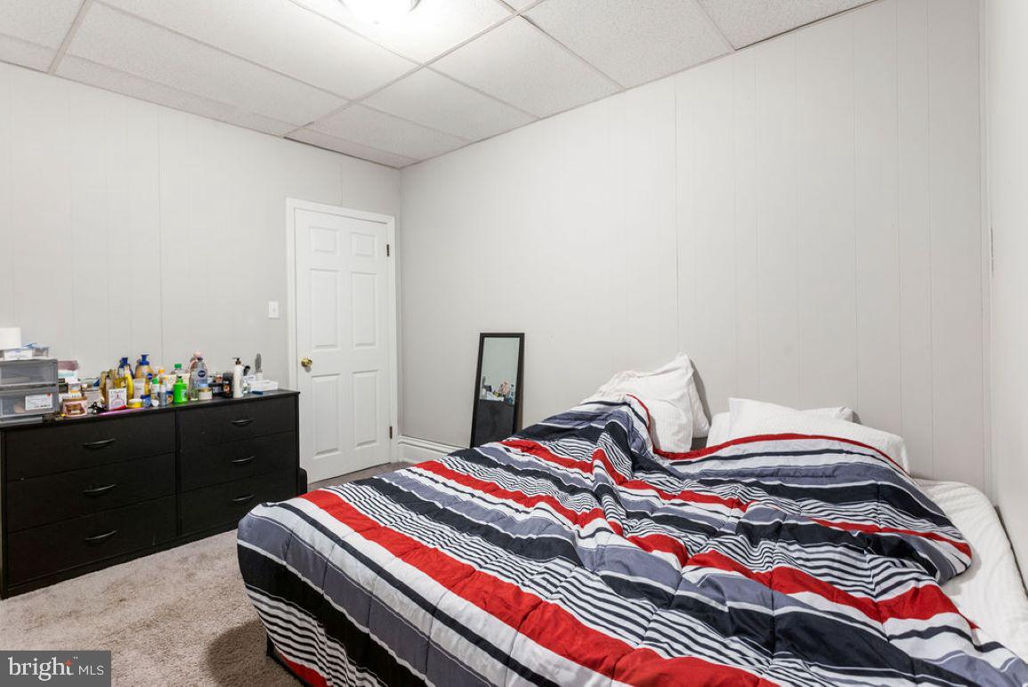 128 High Street Hanover, PA 17331 - Photo 23 of 36 a bedroom with a bed and a dresser