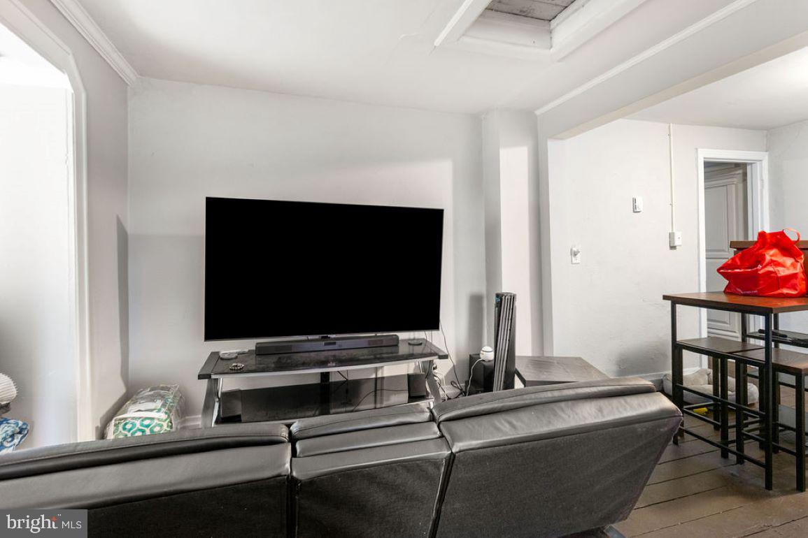 128 High Street Hanover, PA 17331 - Photo 29 of 36 a room with furniture and flat screen tv