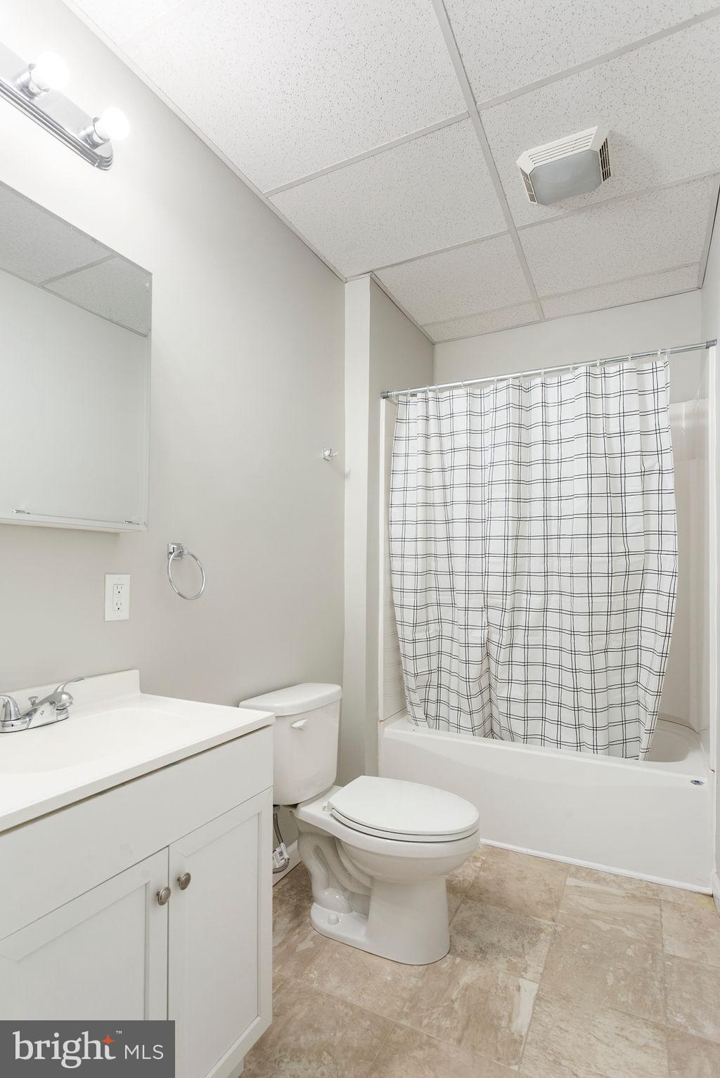 128 High Street Hanover, PA 17331 - Photo 6 of 36 a bathroom with a toilet sink and shower