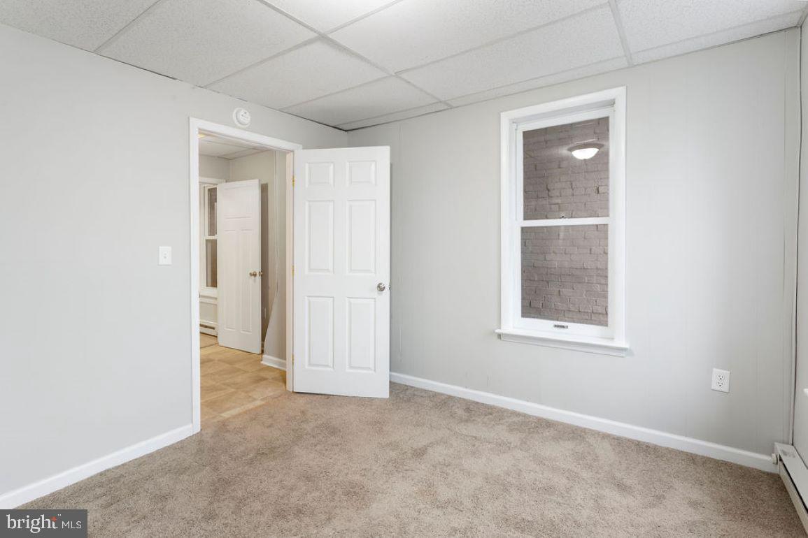 128 High Street Hanover, PA 17331 - Photo 9 of 36 an empty room with windows and closet