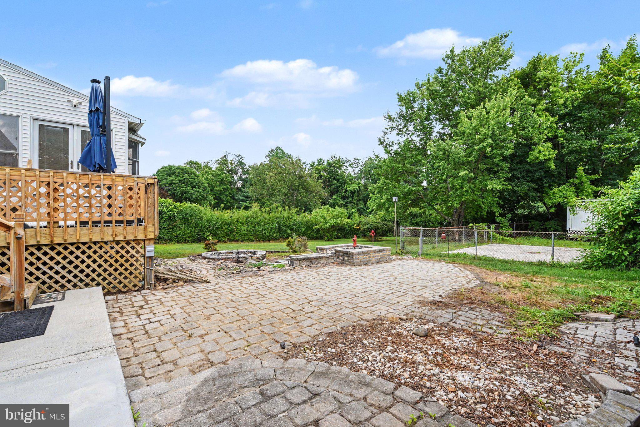 922 Valley Road Enola, PA 17025 - Photo 26 of 34 Serene backyard retreat with greenery.