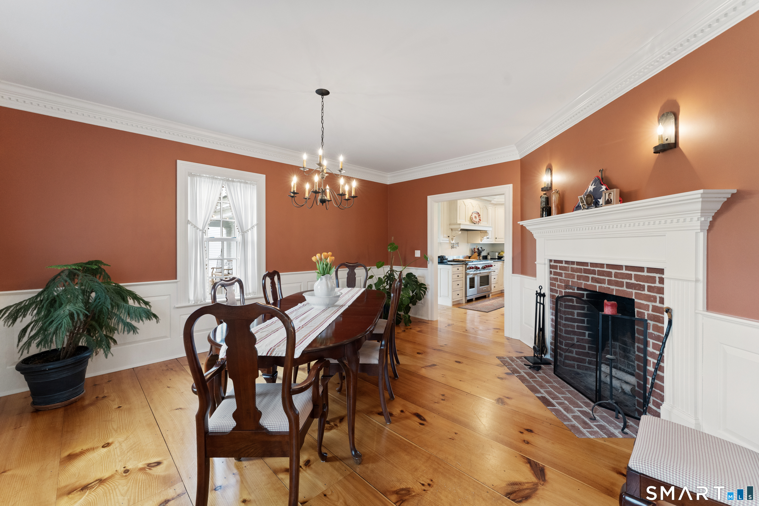 155 Paine Road Woodstock, CT 06281 - Photo 21 of 40 a view of a dining room with furniture and chandelier