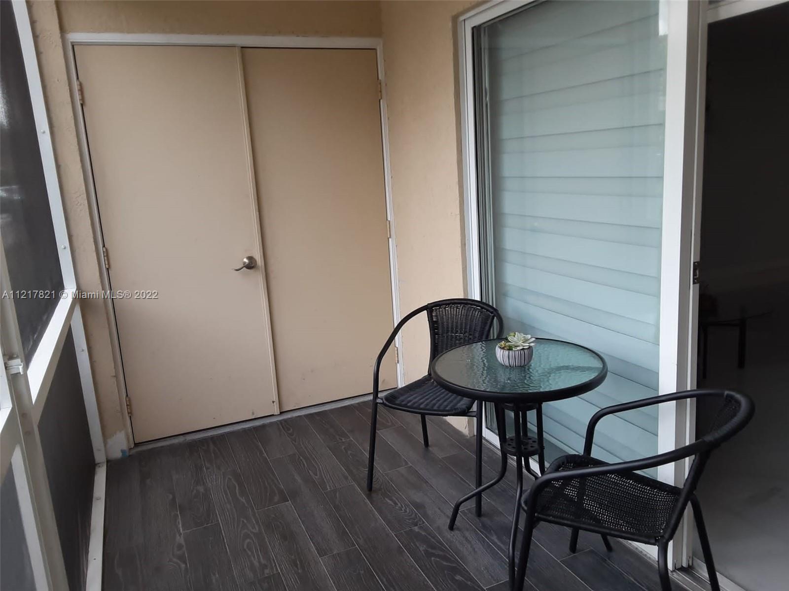 450 South Park Road, Unit 5110 Hollywood, FL 33021 - Photo 8 of 22 a view of a room with a table and chairs