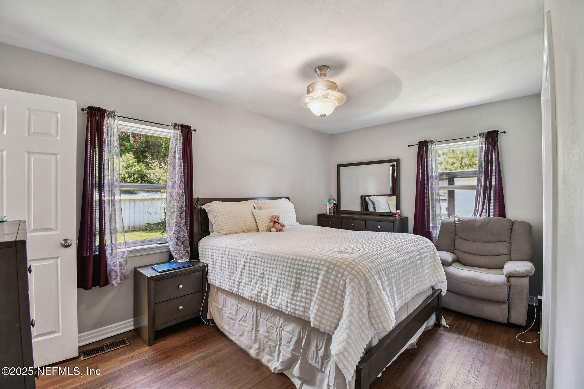 623 Mandalay Road Jacksonville, FL 32216 - Photo 16 of 36 a bedroom with a bed and a couch