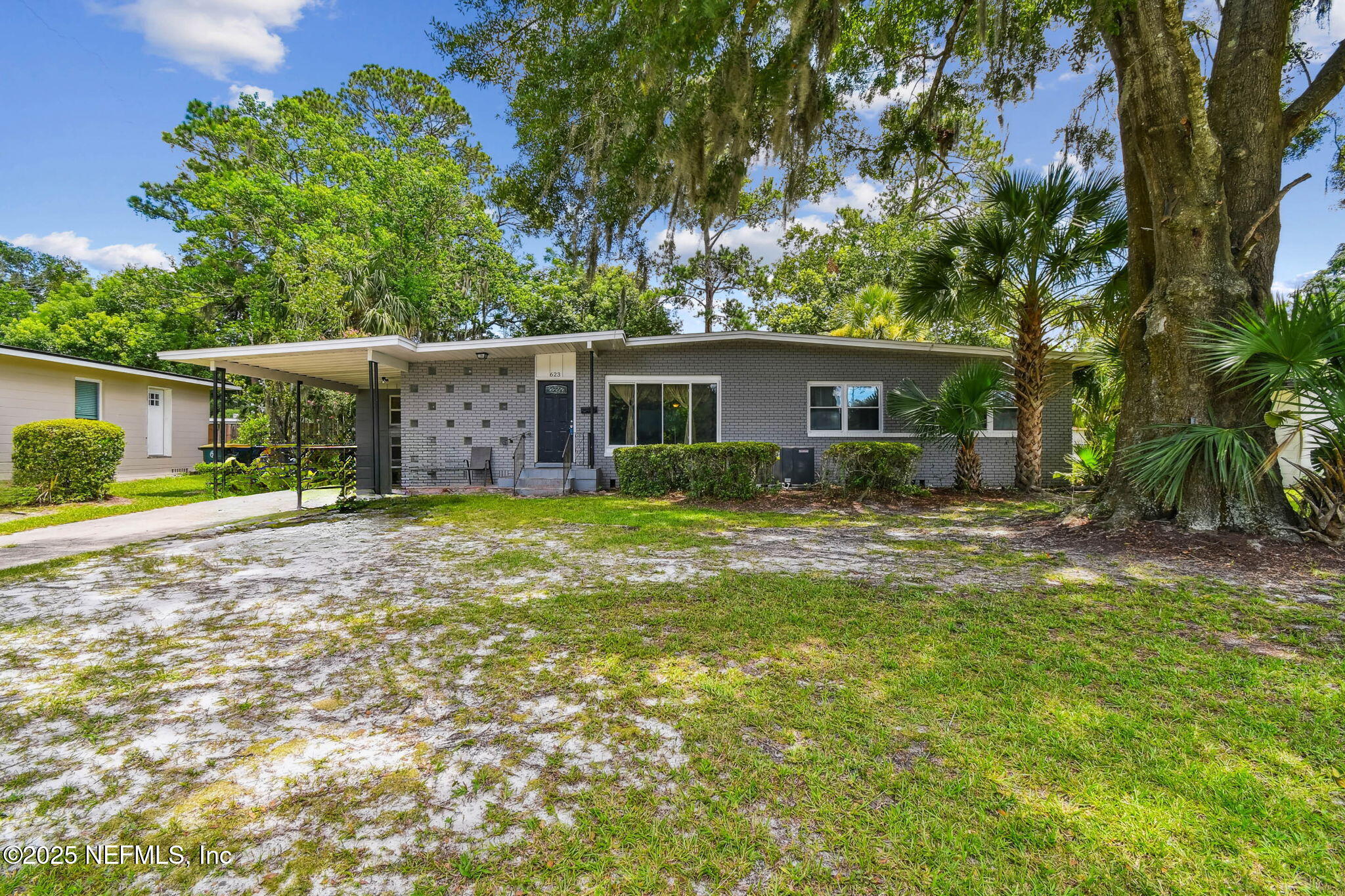 623 Mandalay Road Jacksonville, FL 32216 - Photo 26 of 36 a view of a house with backyard and sitting area