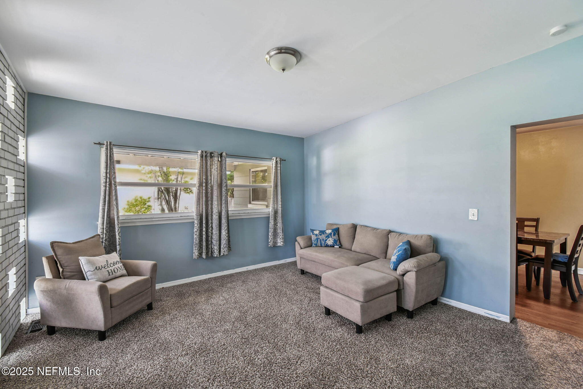 623 Mandalay Road Jacksonville, FL 32216 - Photo 3 of 36 a living room with furniture and a window
