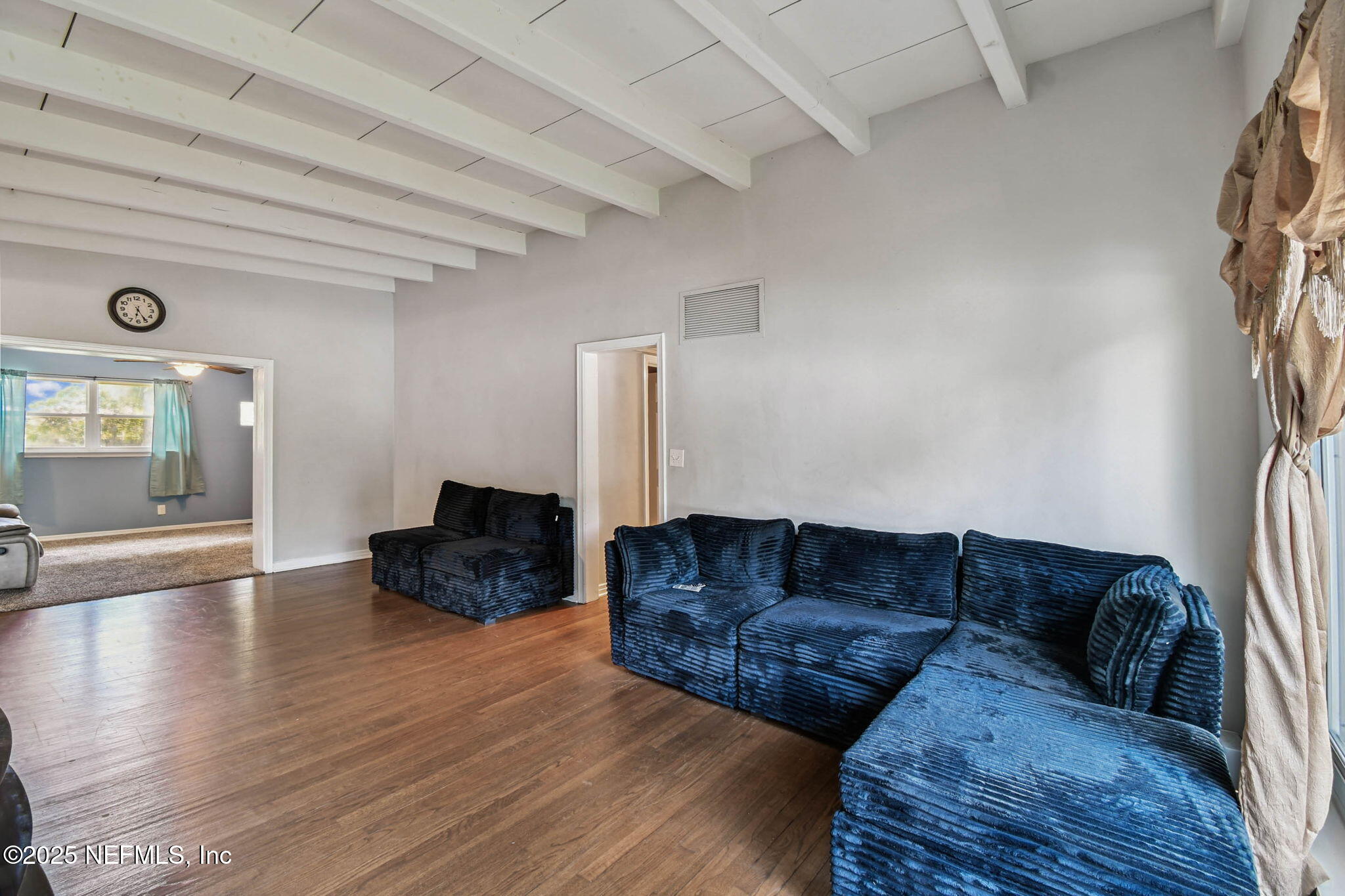623 Mandalay Road Jacksonville, FL 32216 - Photo 5 of 36 a living room with furniture and a wooden floor