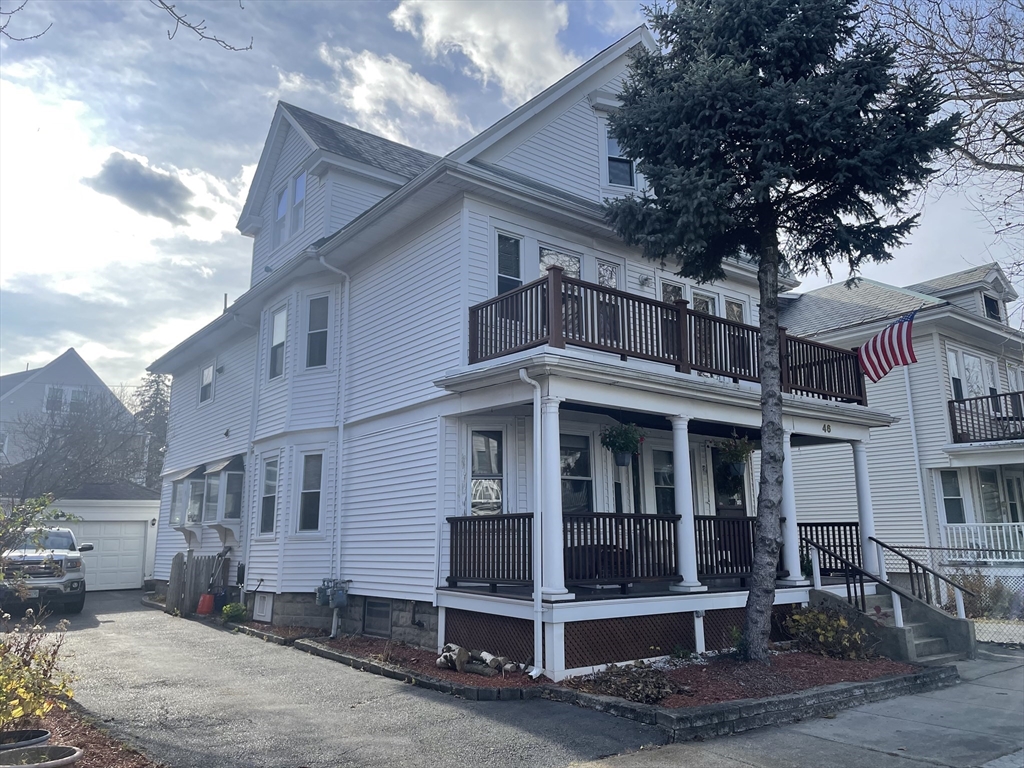 46 Walker Street, Unit 2 Somerville, MA 02144 - Photo 1 of 18 a front view of a house with a porch