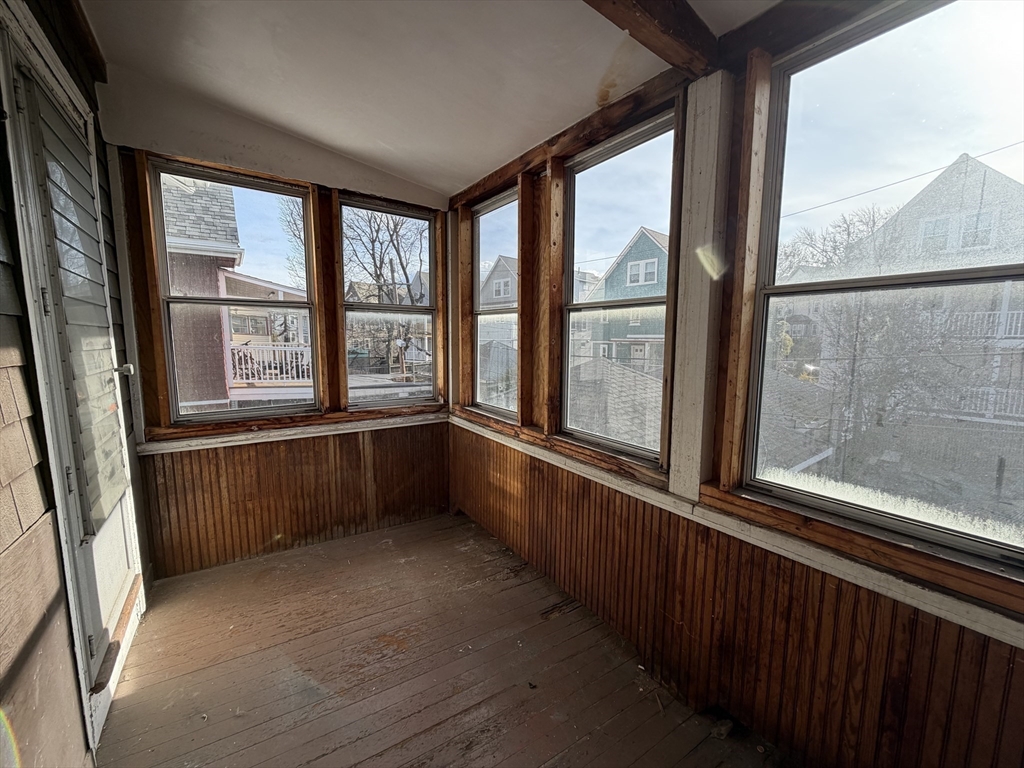 46 Walker Street, Unit 2 Somerville, MA 02144 - Photo 17 of 18 a view of an empty room with a large window