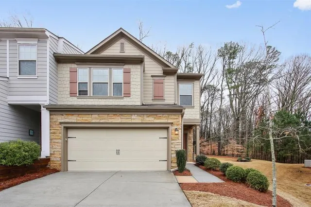 a front view of a house with garage