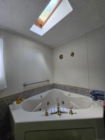 a bathroom with a tub and sink