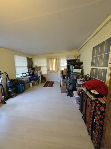 a living room filled with furniture and a flat screen tv