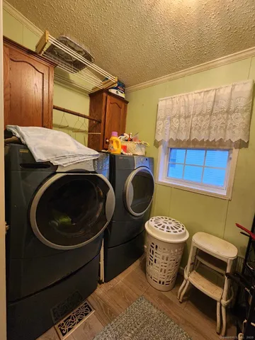 a utility room with a sink a washer and dryer