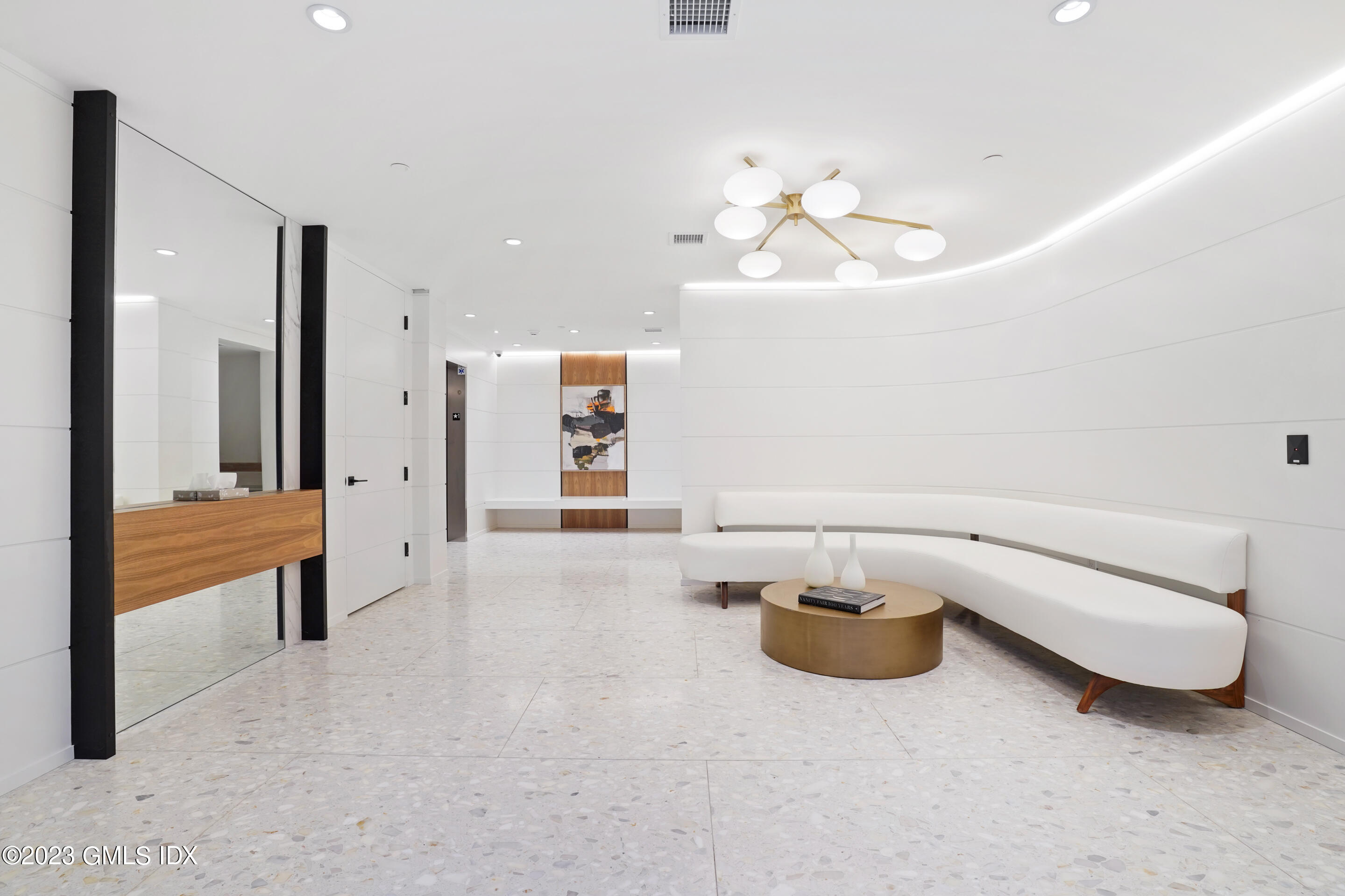 89 River Road, Unit 204 Cos Cob, CT 06807 - Photo 13 of 25 a living room with furniture a table and chair