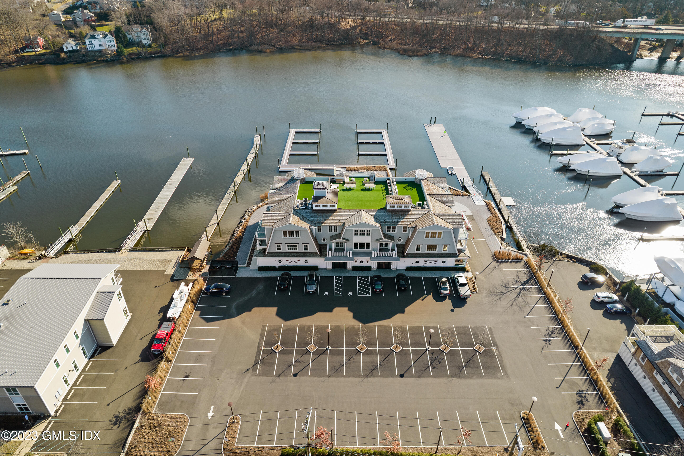 89 River Road, Unit 204 Cos Cob, CT 06807 - Photo 21 of 25 a view of a lake with couches of the ocean
