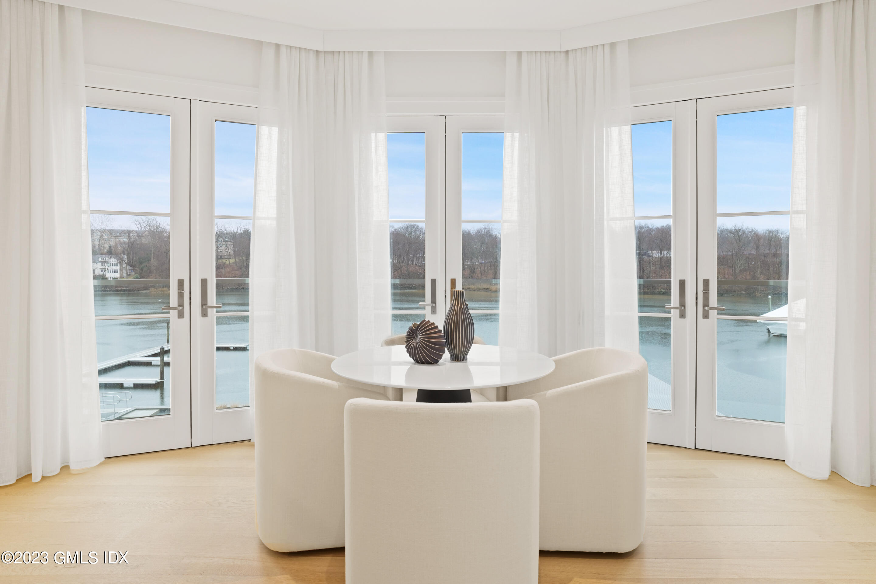 89 River Road, Unit 204 Cos Cob, CT 06807 - Photo 3 of 25 a view of livingroom with furniture and windows