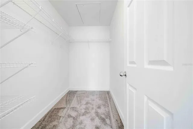 a kitchen with stainless steel appliances granite countertop a refrigerator a stove and a sink with wooden floor